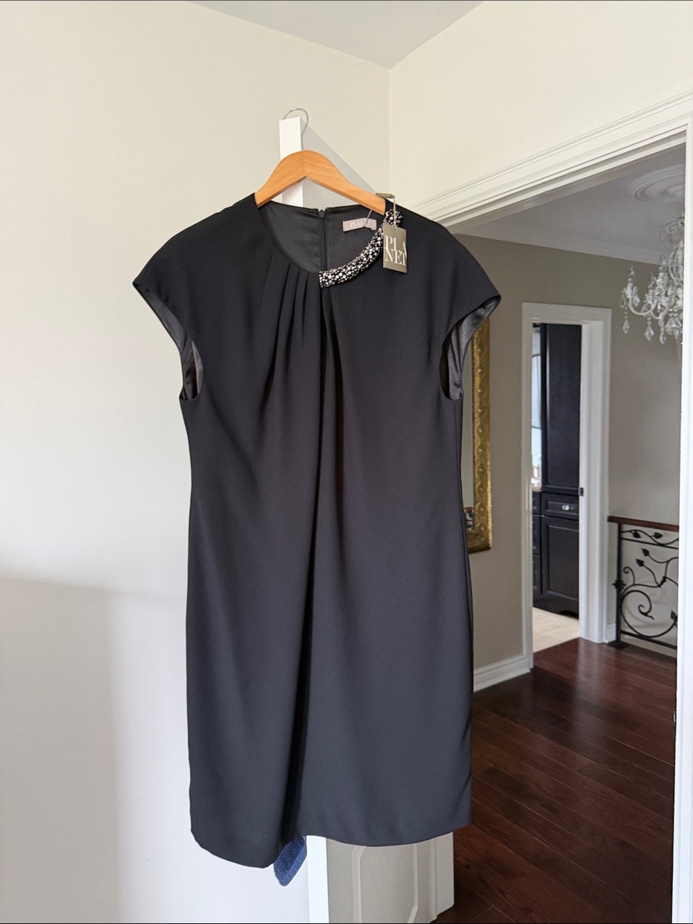 Elegant Black Cap-Sleeve Mini Dress with Embellished Neckline